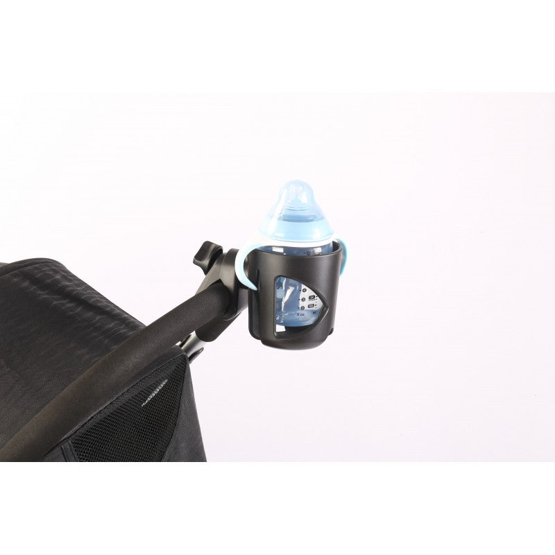 A baby bottle in a Stroller Cup Holder