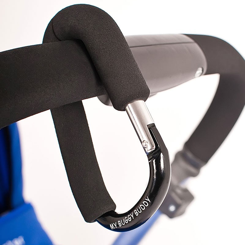The My Buggy Buddy Clip - Black hung on a pram.