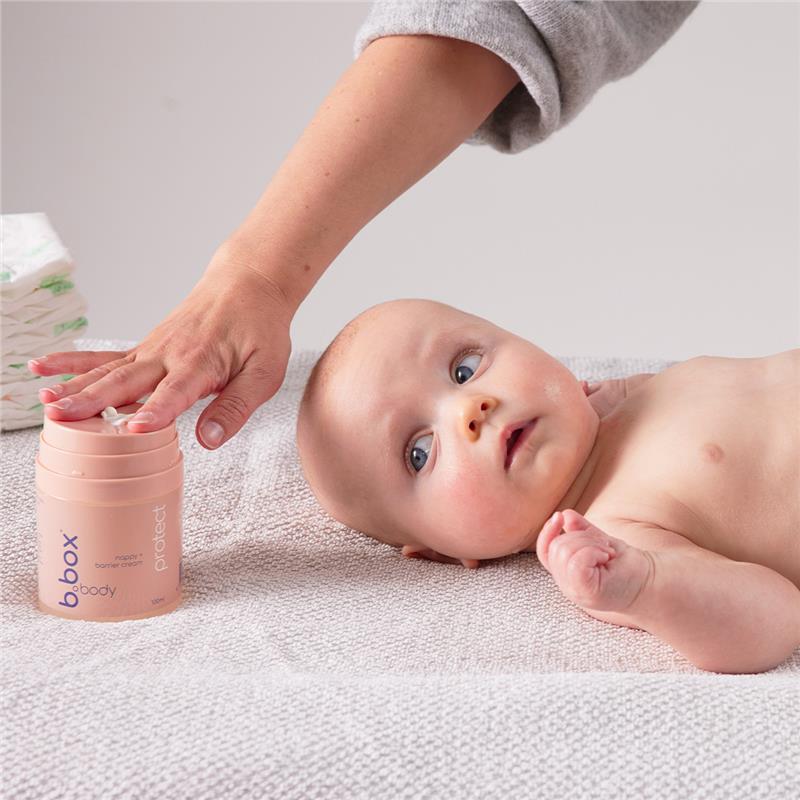 Mother applying Protect Nappy and Barrier Cream (100ml) on her baby