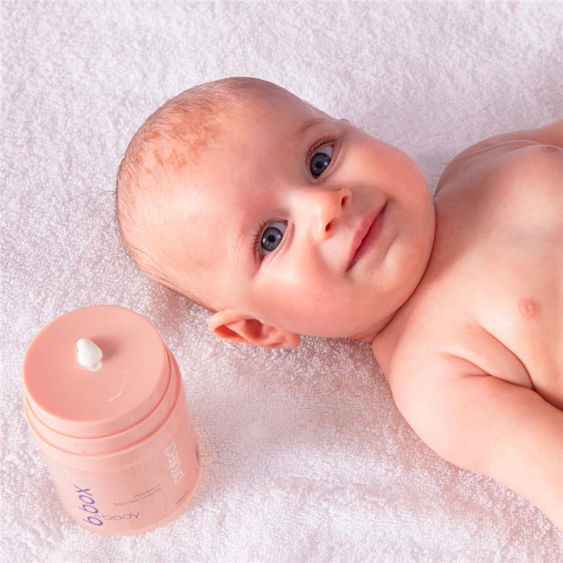 A happy baby with the Protect Nappy and Barrier Cream (100ml)