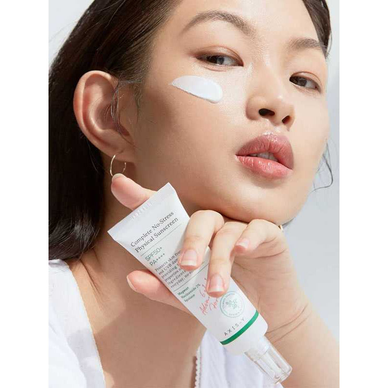Woman applying the complete no stress physical sunscreen - Complete No-Stress Physical Sunscreen (50ml)