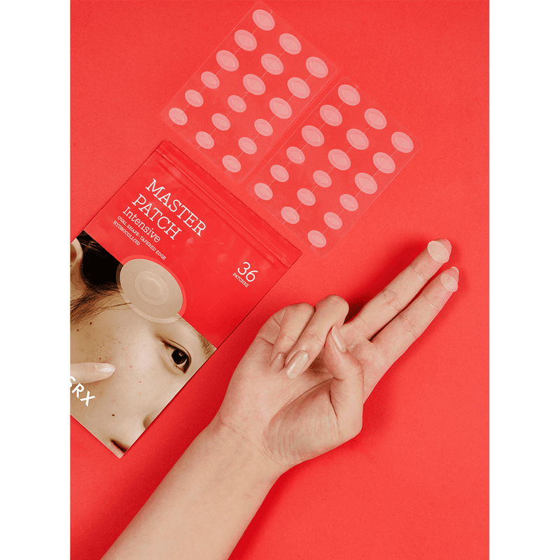 Woman taking a pimple patch on her finger - Master Patch Intensive (36pcs)