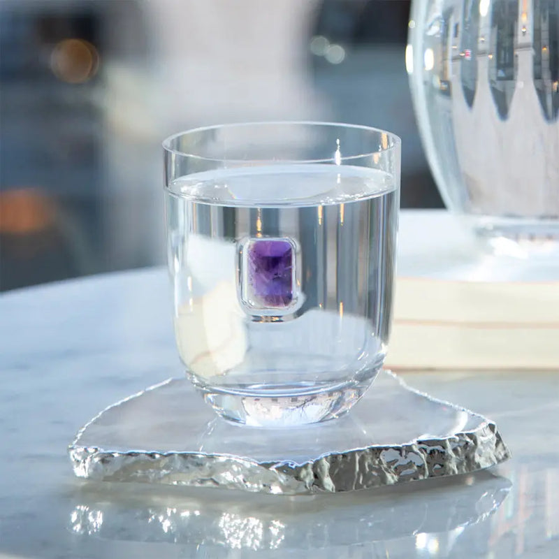 Luxurious Glass with water in it on a coaster - in white background - Elevo DOF - Amethyst S2 Anna New York