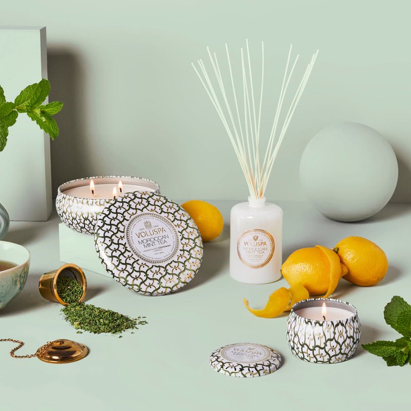 Beautiful Moroccan Mint Reed Diffuser with lemons, green tea leaves in a white background