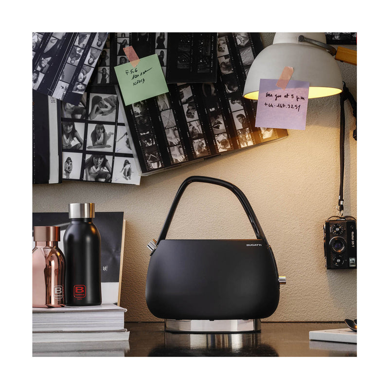 Smart Black Electric Kettle on a nice desk with books and table lamp - By Casa Bugatti