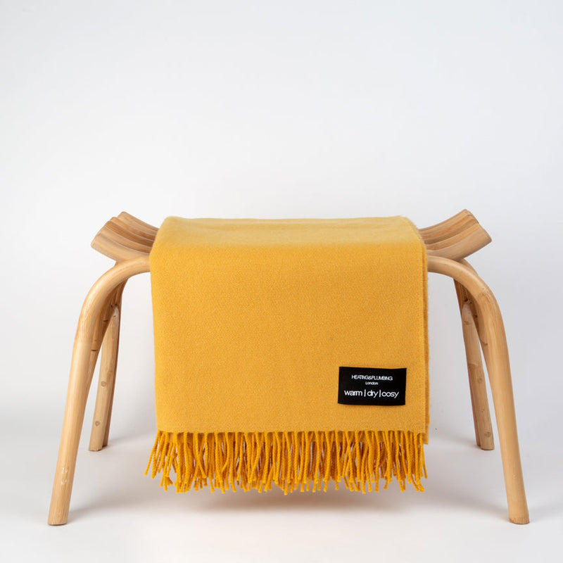 Beautiful Daydreams Merino Lambswool Throw on a seat - Sunflower Yellow in white background